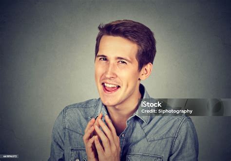 Sneaky Scheming Young Man Trying To Plot Something Stock Photo