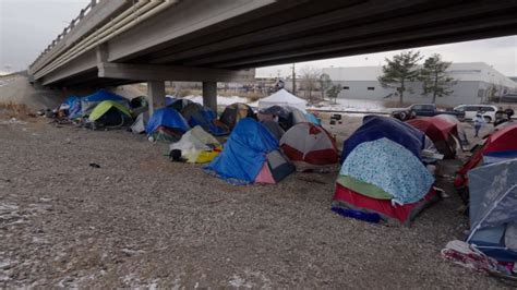 Migrants look for shelter in Denver as temperatures dip below zero | CNN