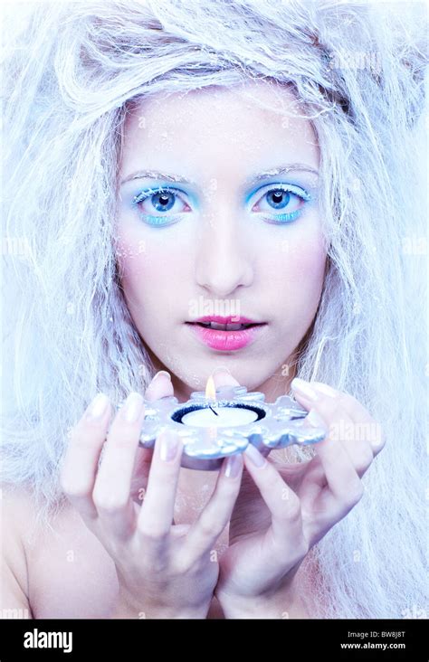 Portrait Of Beautiful Blonde Frozen Fairy Girl With Candle Stock Photo Alamy