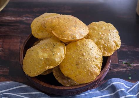 Masala Poori Puffed Puri Recipe Masaledar Puri Dine Delicious