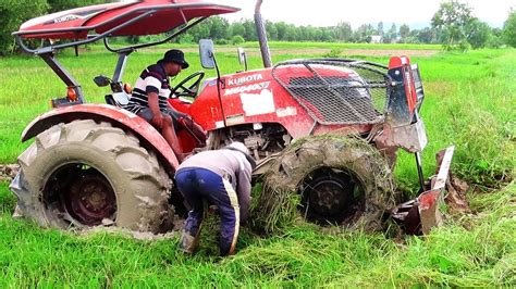 Tractor M6040su Stuck In Mud Ingeniously Working Tractor Getting