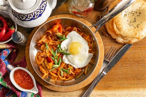 Premium Photo | Traditional uzbek hot dish fried lagman. fried noodles ...