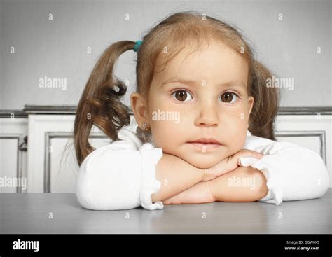 Porteait Of Serious Dreaming Child Girl In Room Stock Photo Alamy