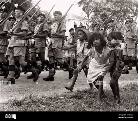 British soldiers marching in Georgetown British Guiana followed by Stock Photo, Royalty Free ...