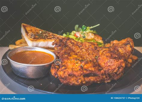 Deep Fried Chicken Fillet With Toast Sauce Baked Beans French Fries And Salad Stock Image