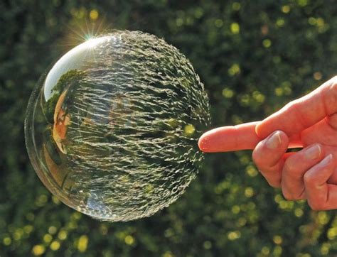 Slow motion picture sequence of bubble being popped | Geek Slop