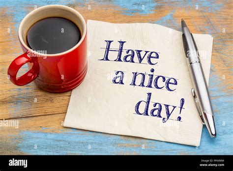 Have A Nice Day Handwriting On A Napkin With Cup Of Coffee And Pen