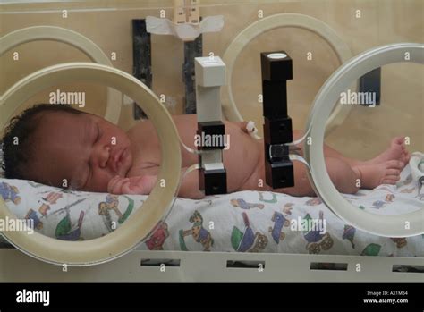 Baby In Incubator Stock Photo Alamy