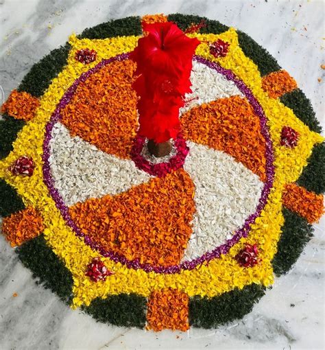 An Arrangement Of Flowers Arranged In The Shape Of A Flower Wheel On A