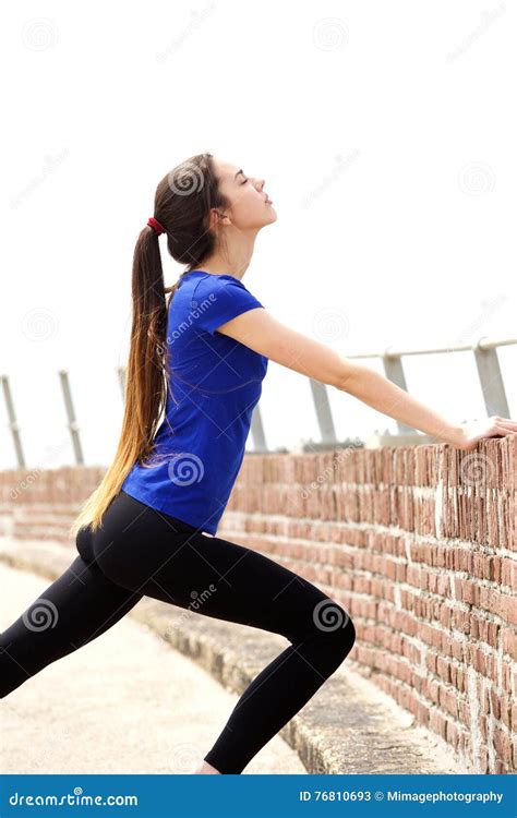 Active Young Woman In Pushing Against Wall Stock Image Image Of