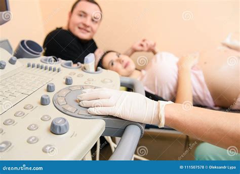 Hands Of A Doctor Who Uses Medical Ultrasound Diagnostic Machine Stock