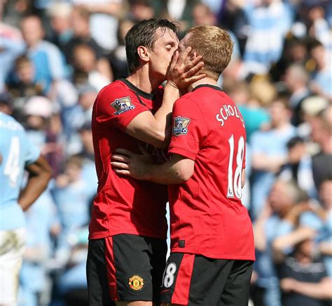 Gary Neville Responds As Angry Arsenal Fans Use Pic Of Him Smooching