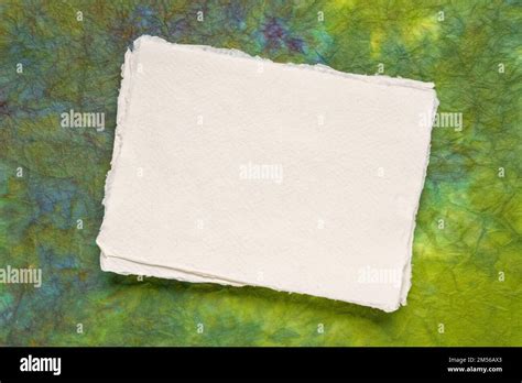 Small Sheet Of Blank White Khadi Rag Paper From South India Against