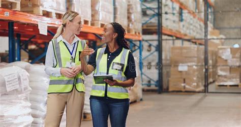 Women Tablet And Partner In Discussion At Warehouse For Logistics