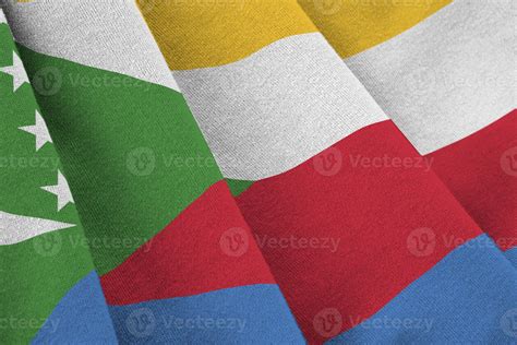 Comoros Flag With Big Folds Waving Close Up Under The Studio Light