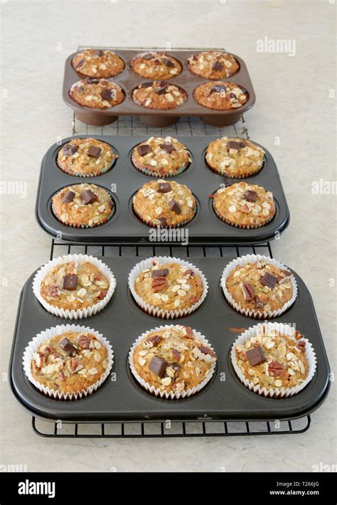 Home Baked Oat Pecan Chocolate Chunk Banana Muffins Cooling On Racks