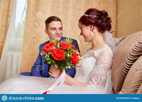 Russian Bride And Groom In The Room At Home In Ordinary Interior Of