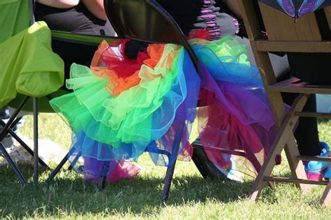 Premium Photo Rear View Of People Sitting On Chairs During Gay Pride