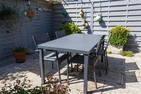 Flowered Terrace with Garden Furniture Stock Photo - Image of table ...