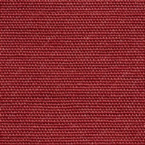 Premium Photo | A dark red fabric with a woven pattern.