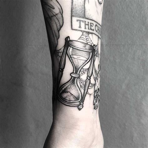 Wrapping Hourglass Tattoo On The Right Wrist By Lozzy Bones Hourglass