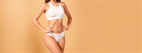 Premium Photo Tanned Woman In Great Shape Posing In Lingerie Perfect Body Shape Generative AI