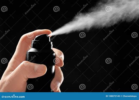 Man Spraying Deodorant On Dark Background Stock Photo Image Of