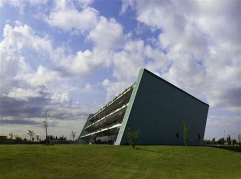 Trapezoid Shaped Eye Bank Building Hugs A Slope Of Stepped Green Terraces