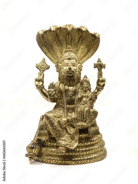 golden statue of lord vishnu avatar, narasimha lion faced with multiple hands sitting on a snake ...