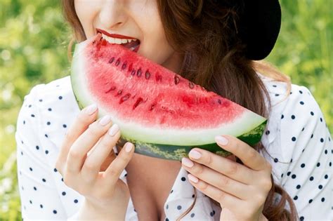 Premium Photo Woman Eating Slice Of Watermelon