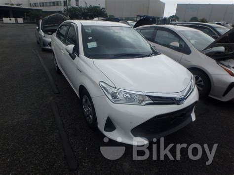 Toyota Axio Ex White Hyb Grade For Sale In Gulshan Bikroy