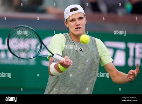 Jakub Mensik, of the Czech Republic, returns a shot against Ben Shelton ...