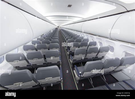 Typical interior of commercial passenger airplane Stock Photo - Alamy