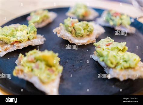 Pork Rinds With Guacamole On Traditional Mexican Comal Stock Photo Alamy