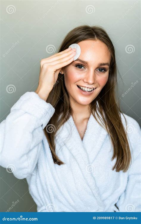 Beautiful Woman Touching Her Face With Sponge And Smiling While