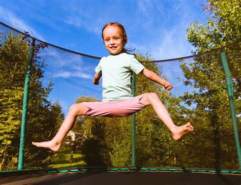 Happy Kid Jumping on Trampoline Outdoors on Sunny Summer Day Stock Photo - Image of bounce ...