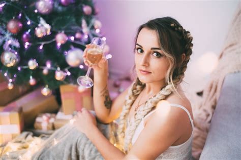 Premium Photo Sexy Girl In Lingerie With Two Pigtails And A Glass Of Champagne Near The