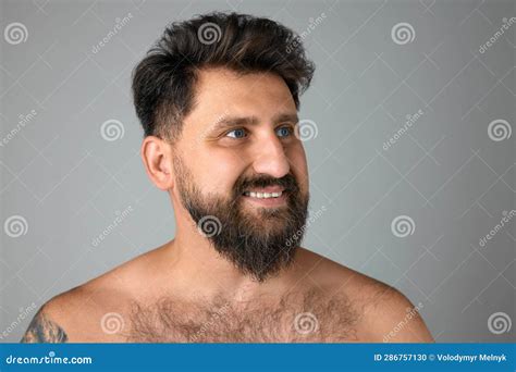 Bearded Smiling Mature Handsome Man With Blue Eyes Standing