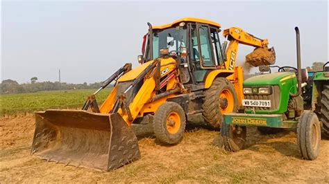 New Jcb Dx Xtra Machine Loading Mud In John Deere D Tractor For