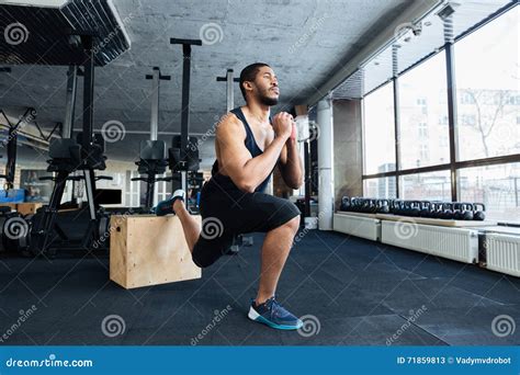 Muscular Fitness Man Doing Squats In The Gym Stock Image Image Of