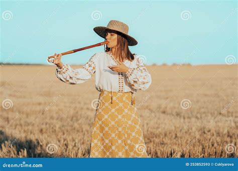 Woman Playing on Woodwind Wooden Flute - Ukrainian Telenka or Tylynka ...
