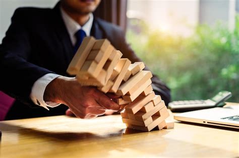 Premium Photo Midsection Of Businessman Holding Wooden Blocks On