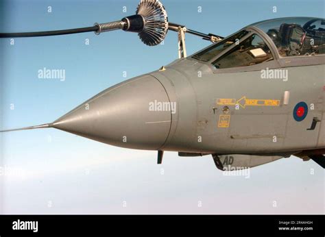 Us Navy A Royal Air Force Gr4 Tornado Attack Aircraft Refuels Off The Right Wing Of A British Vc