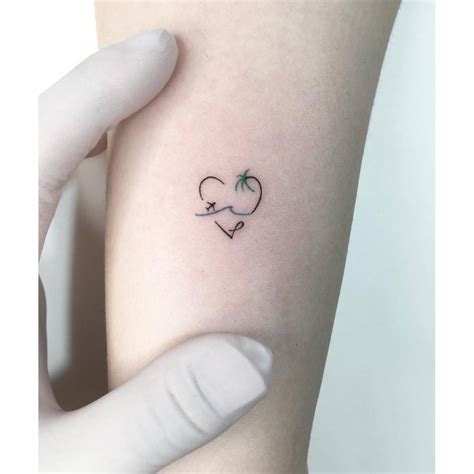 Minimalistic Beach Heart Tattoo Located On The Wrist