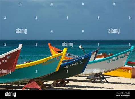 ROW OF BRIGHTLY PAINTED YOLA FISHING BOATS CRASH BOAT BEACH AGUADILLA