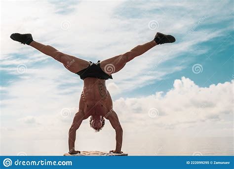 Young Man Is Doing Street Workout Handstand Exercise Bodyweight Stock