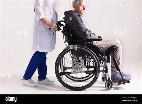 Old Man Pushing Wheelchair Hi Res Stock Photography And Images Alamy