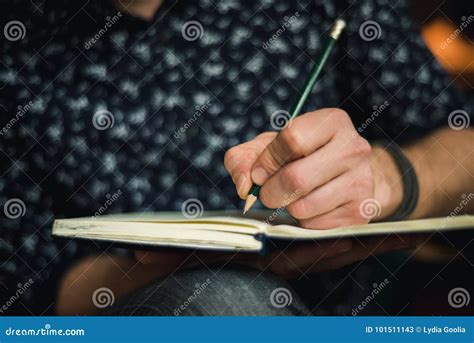 Man Writing in Journal with a Pencil Stock Image - Image of action ...