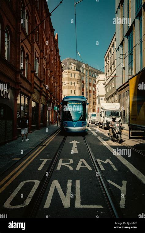 BIRMINGHAM, UK - JULY 18, 2022. A West Midlands Metro Tram travelling along tracks on the city ...