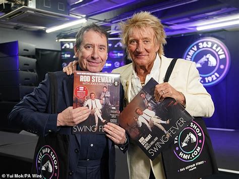 Sir Rod Stewart And Jools Holland Beam With Golden Trophy As They Reach